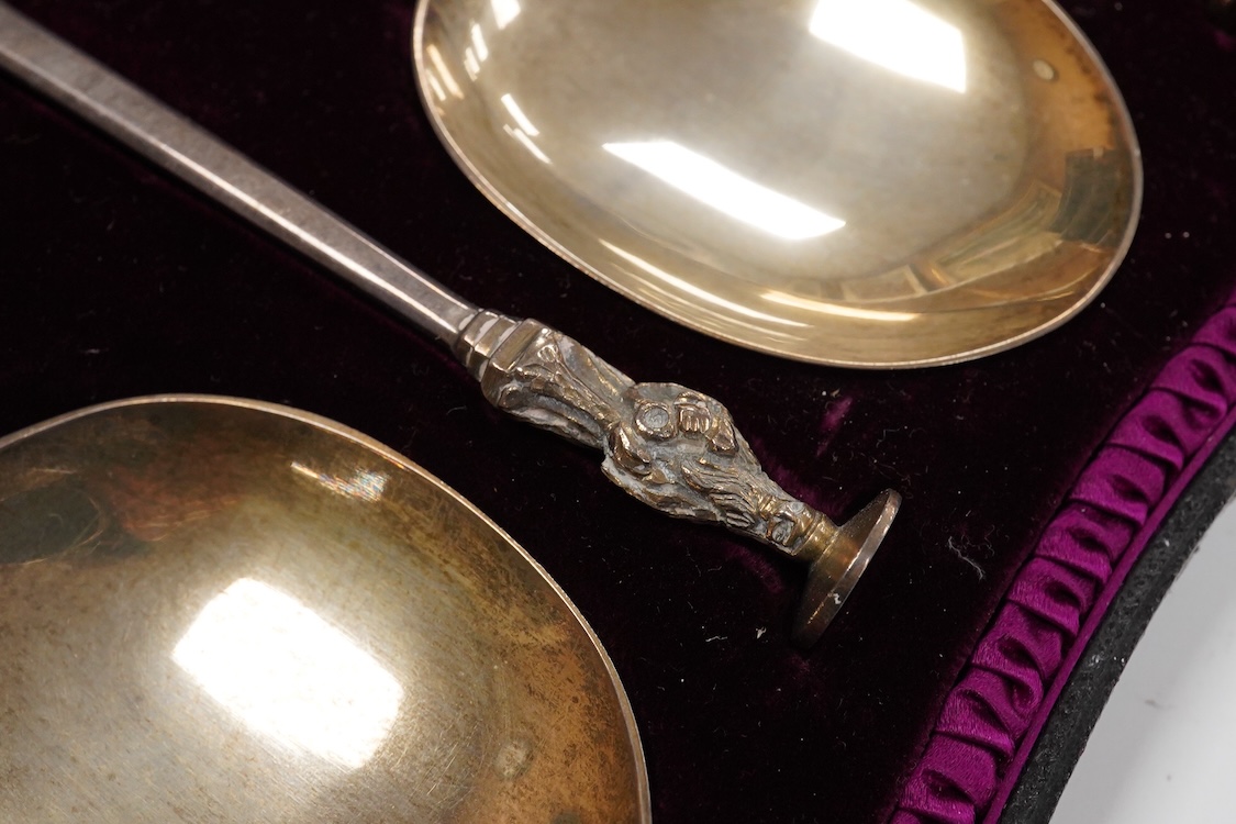 A late Victorian cased set of four silver apostle serving spoons, by Wakely & Wheeler, London, 1890, 19.6cm, 6.5oz.